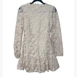Ivory lace dress with long sleeves and a ruffled hem